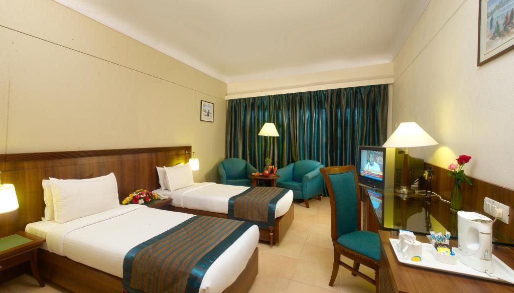 Uday Suites - The Airport Hotel Thiruvananthapuram Rom bilde